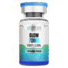 A clear glass vial containing a lyophilized powder labeled 'GLOW 70MG' with a purity of ≥99%. The vial has a silver cap and a blue top, featuring branding for 'PURE LAB PEPTIDES'.